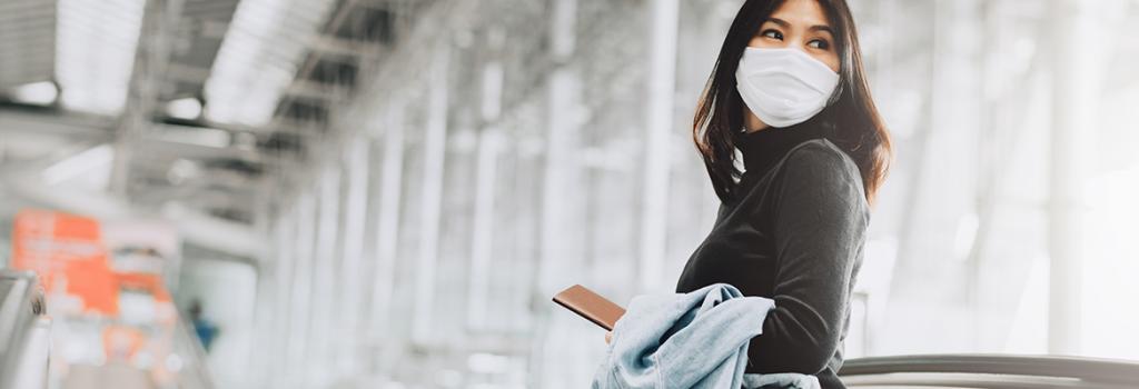 person wearing a mask in an airport